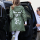 First lady Melania Trump climbs back into her motorcade after traveling to Texas to visit facilities that house and care for children taken from their parents at the U.S.-Mexico border June 21, 2018, at Joint Base Andrews, Md.